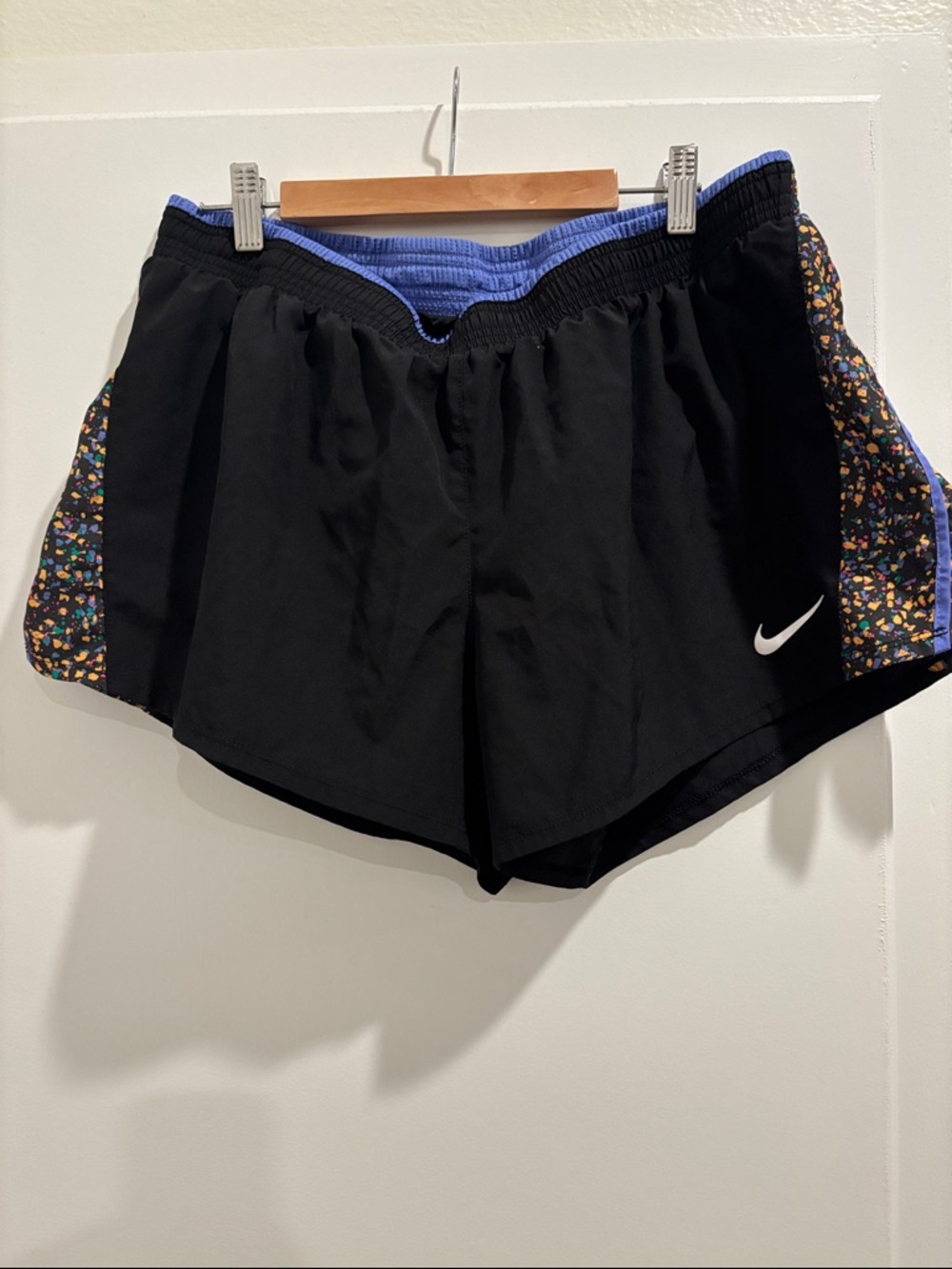 Nike Black Athletic Shorts with Blue Waistband and Multicolor Side Panels